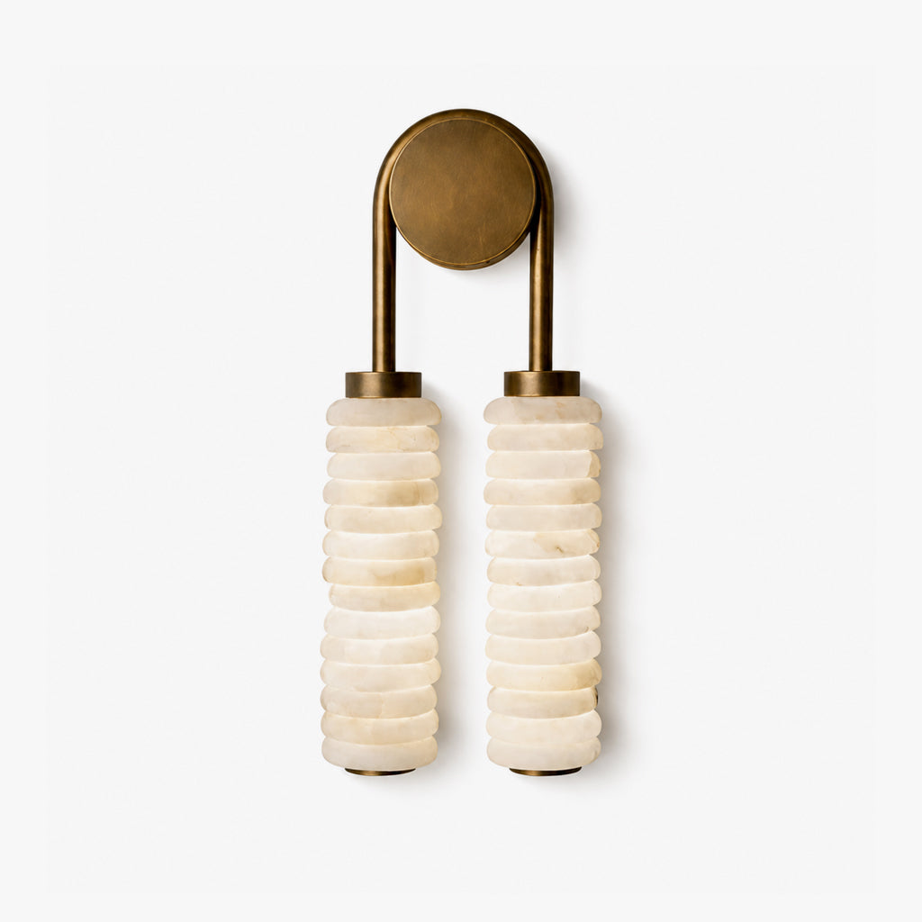 Clear studio shot of twin alabaster sconce double stacked natural stone wall light