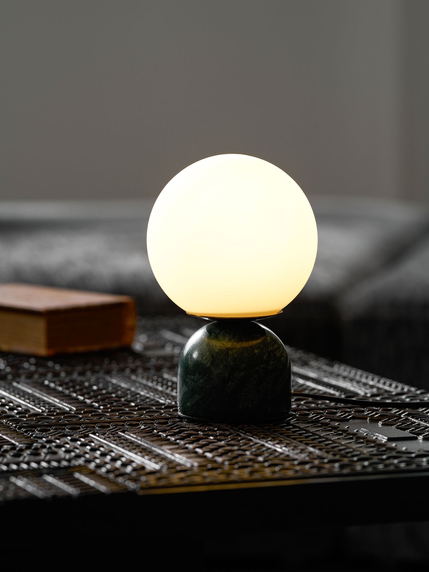 Illuminated Marble Globe Accent Lamp Over Dark Wood Table
