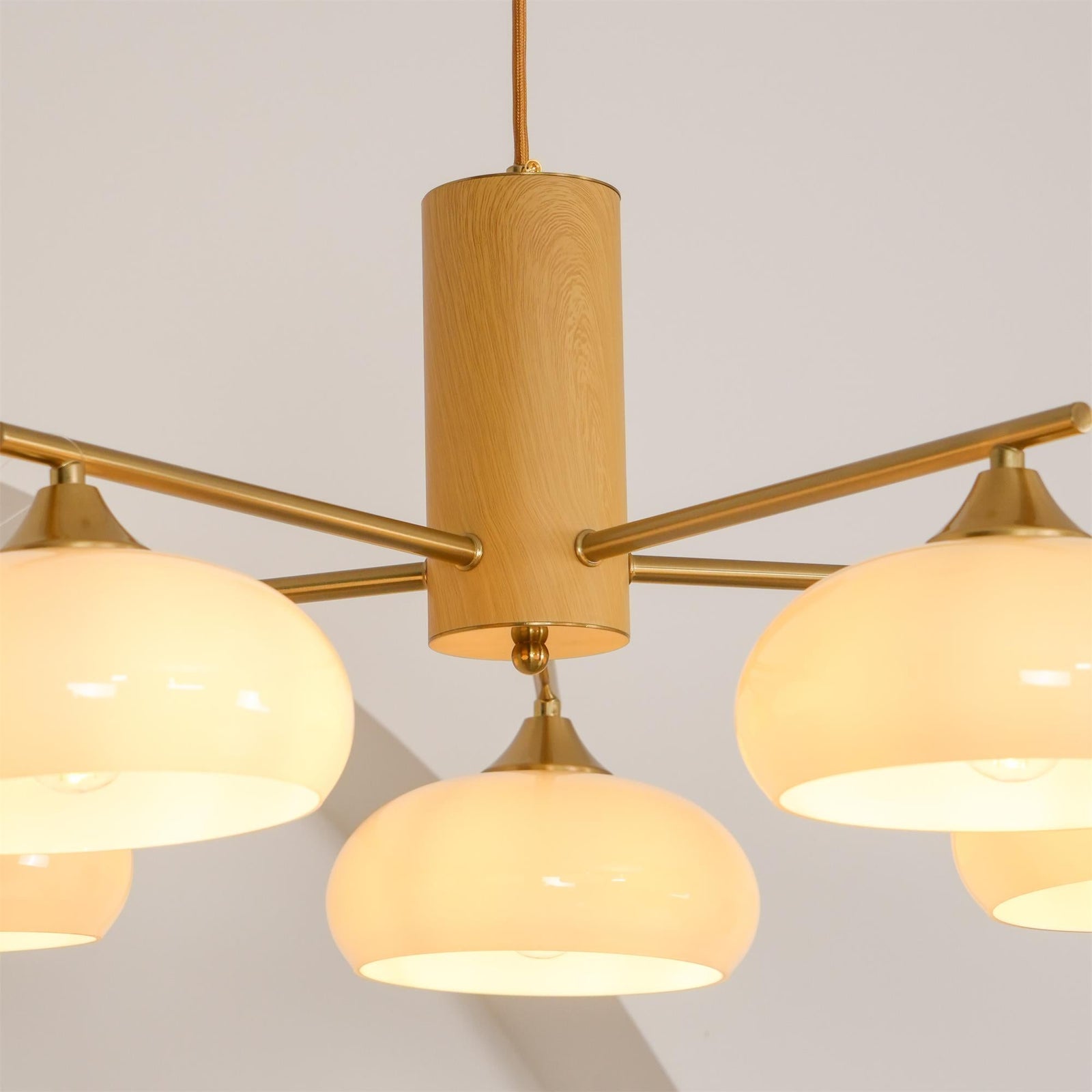 Close Up View of Solid Wood Cylinder and Brass Fixture Head