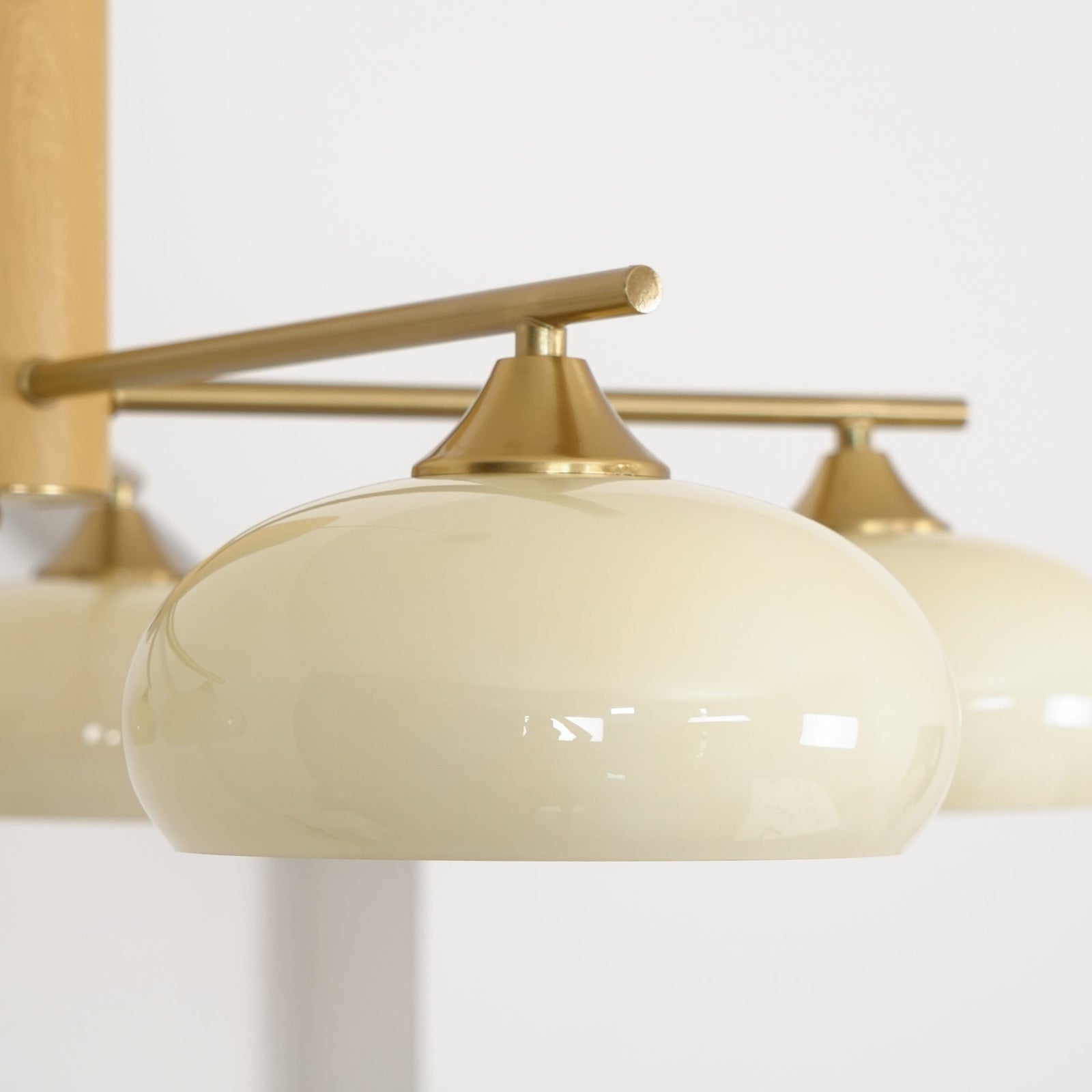 Close Up View of Cream Glass Shade and Brass Hardware