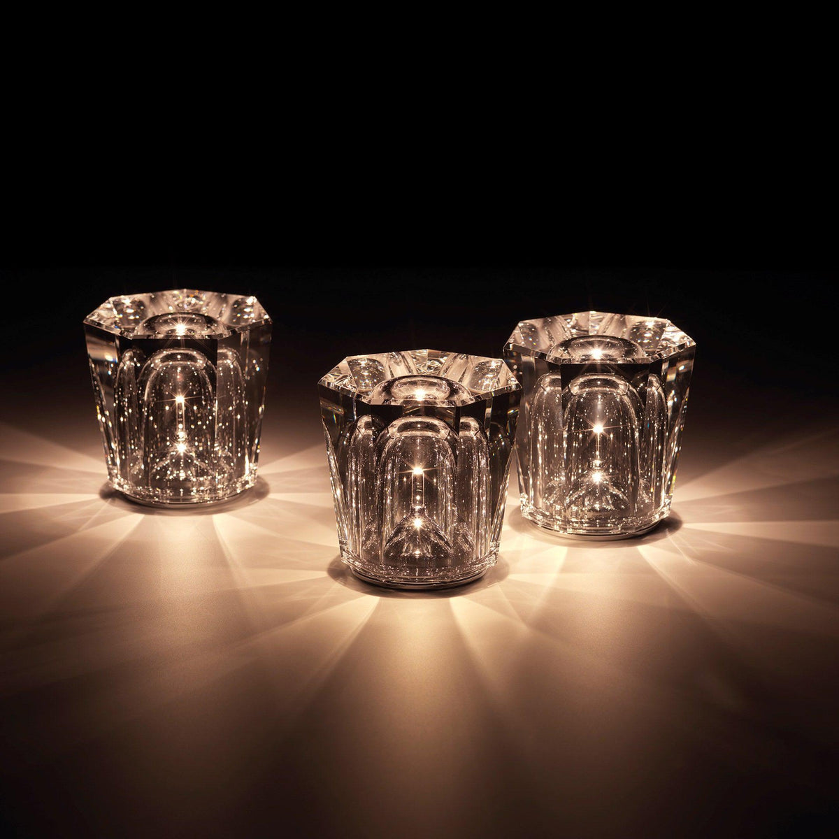 Three Becrux crystal cordless lamps warm lighting against dark background evening display