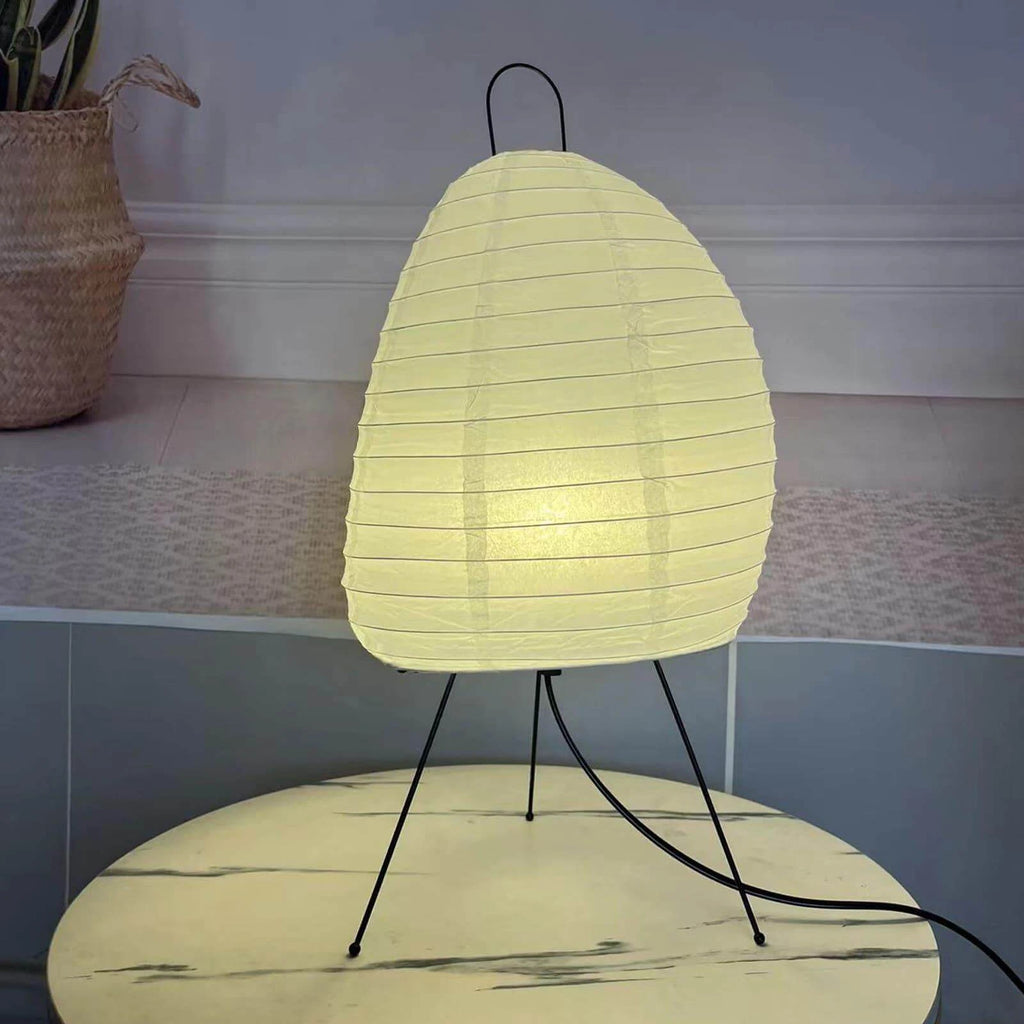Illuminated Modern Paper Lantern Table Lamp on Marble Surface