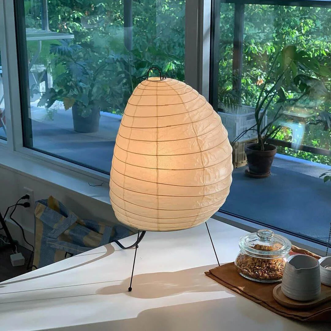 Illuminated Modern Paper Lantern Table Lamp on Window Table with Plants