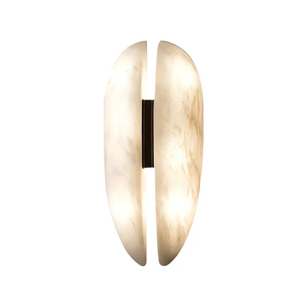 Unlit alabaster veil wall light oval split stone sconce isolated pale neutral backdrop