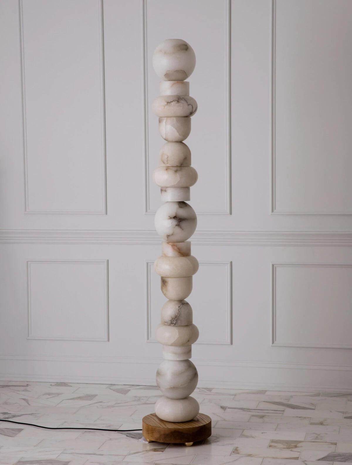 Modern Stacked Alabaster Sphere Floor Lamp Off State Display on White Molding Wall