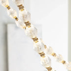 Close Up View of Gold Hardware and Beaded String Material
