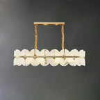 Illuminated Modern Long Brass Band and Petal Alabaster Linear Chandelier Studio Shot on Dark Background