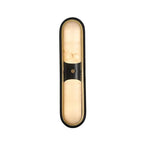 Modern Black Frame and Alabaster Double Oval Wall Sconce with Center Metal Accent and Warm Light on Pure White Background