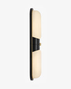 Illuminated Modern Black Frame Alabaster Wall Sconce Side View Studio Shot