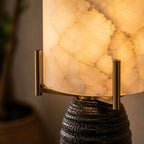Close Up View of Illuminated Alabaster Cylinder Shade and Warm Glow Details