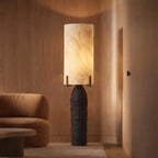 Modern Textured Black Base Table Lamp in Dramatic Interior Lighting Setting