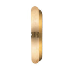 Modern Oval Alabaster and Brass Center Band Wall Sconce with Warm Light on Pure White Background   