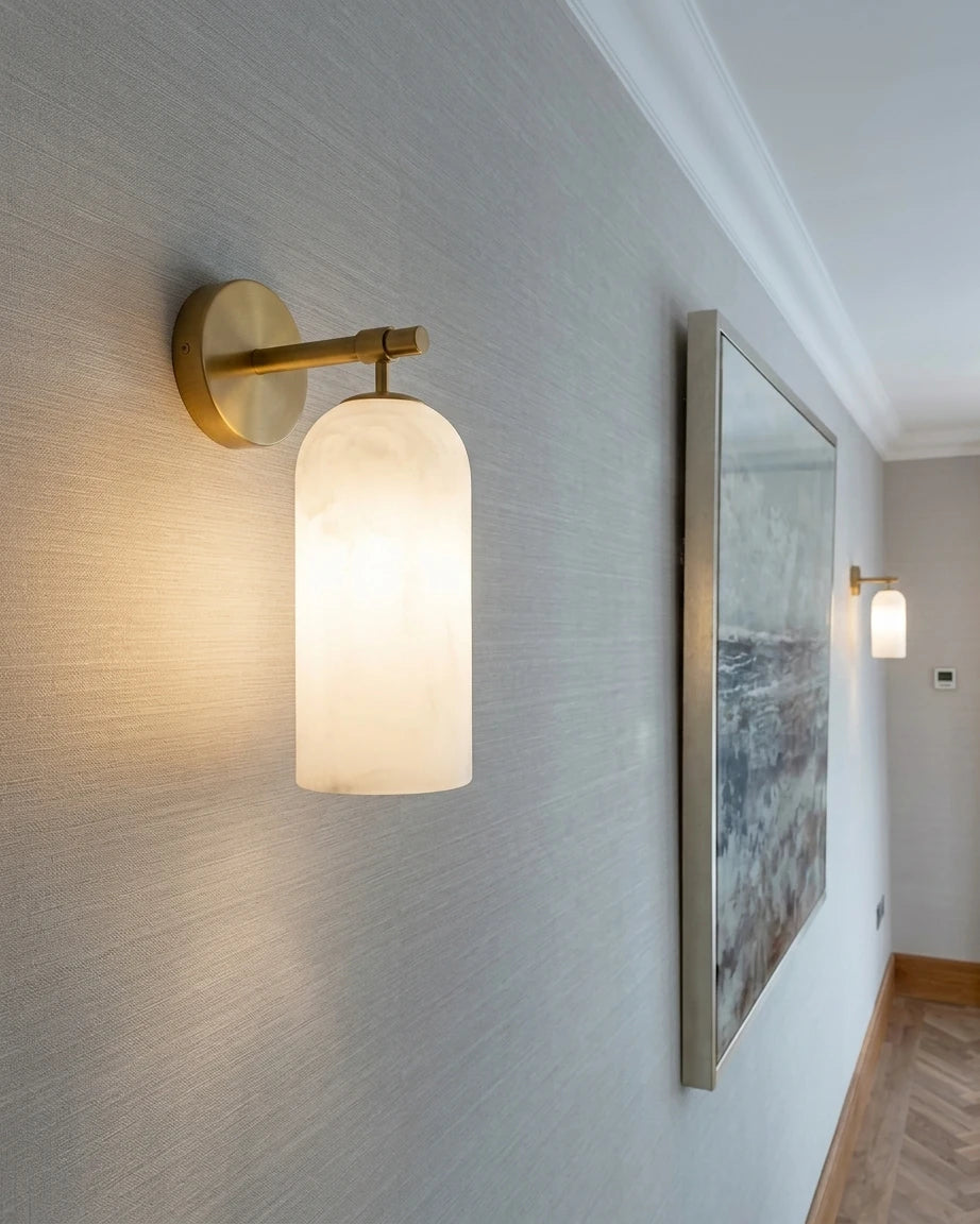 Modern Cylindrical Wall Sconce Over Hallway Art