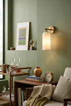 Modern Cylindrical Wall Sconce in Cozy Green Living Area