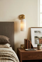Modern Brass Wall Sconce in Master Bedroom Setting