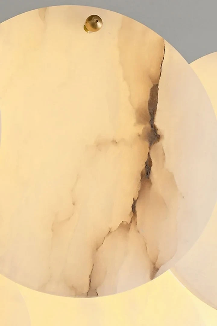 Close Up View of Illuminated Alabaster Discs Natural Vein Texture and Warm Glow Details