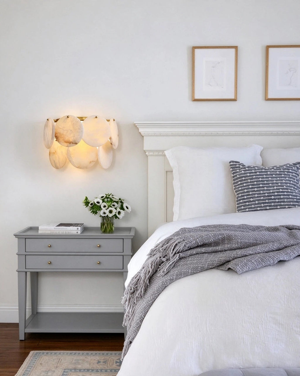 Modern Alabaster Disc Wall Sconce in Minimalist Bedroom Interior