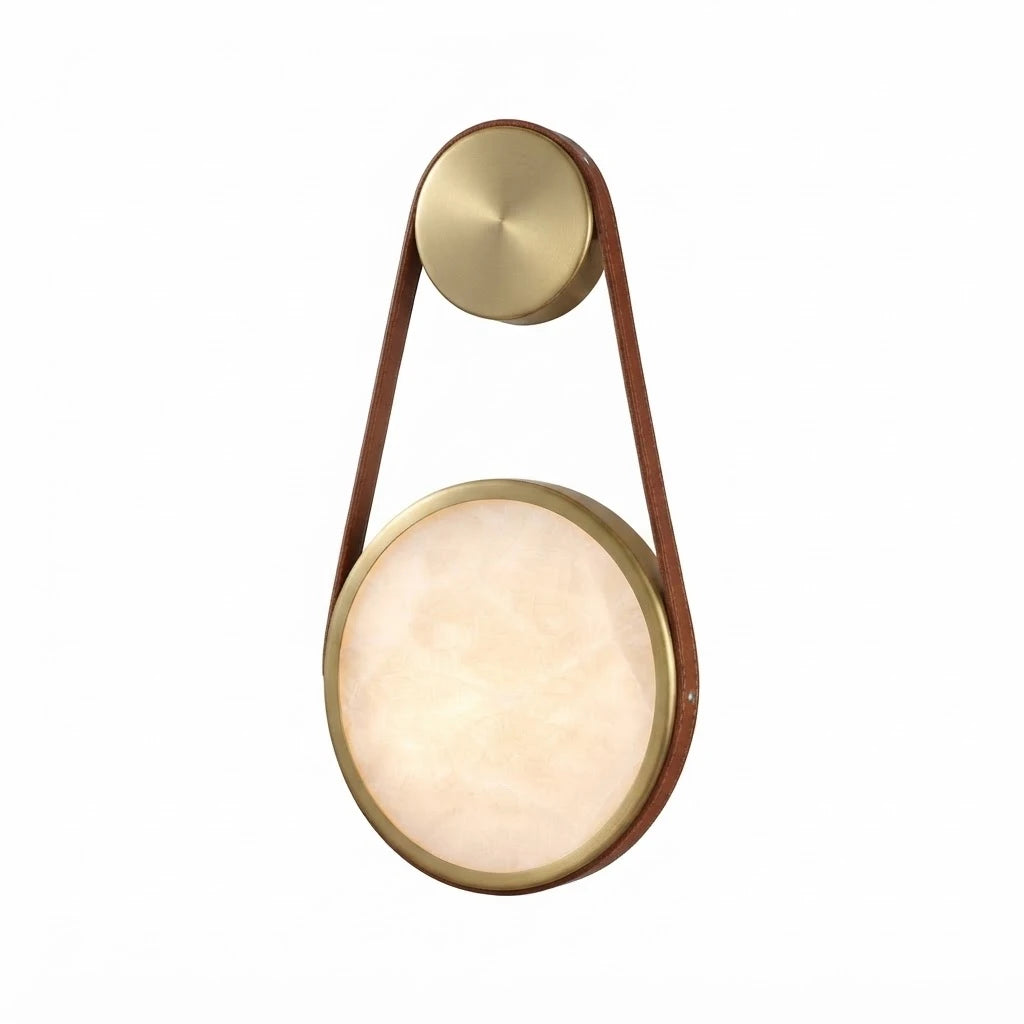 Modern Leather Strap and Alabaster Disc Wall Sconce with Brass Frame and Warm Light on Pure White Background   