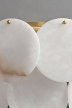 Close Up View of Layered Alabaster Discs and Brass Hardware Connection Details