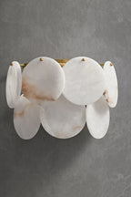 Modern Alabaster Disc Wall Sconce Off State Studio Display on Grey Background