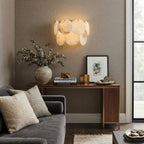 Modern Alabaster Disc Wall Sconce in Cozy Living Area