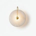 Modern Minimalist Natural Marble Round Disc Art Wall Sconce with Over-the-Top Brass Hook on Pure White Background