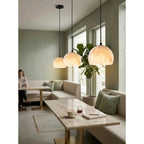 Modern Black Frame Alabaster Pendant Light in Dining Area Interior