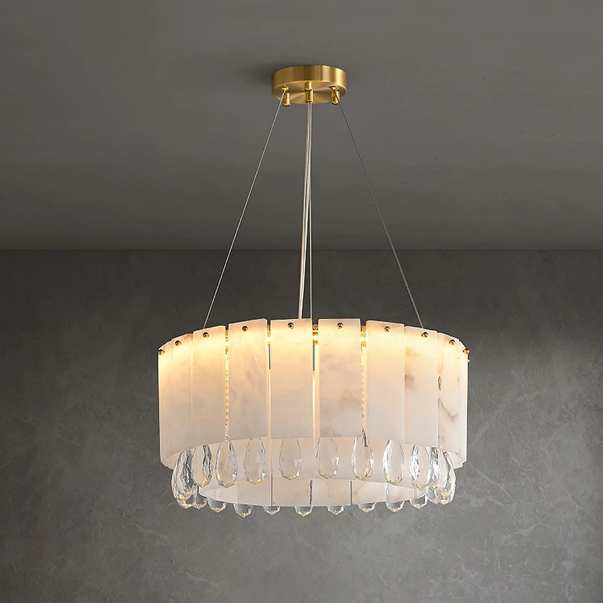 Illuminated Modern Round Alabaster and Crystal Drop Chandelier Studio Shot on Grey Background   