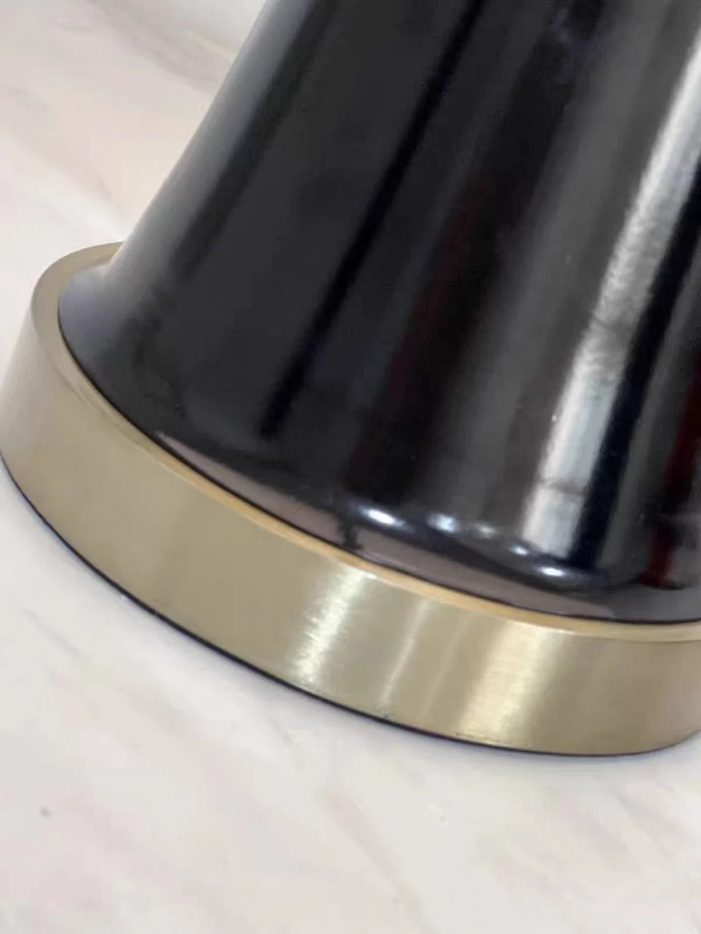 Close Up View of Black Trumpet Base and Bottom Brass Trim Details