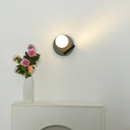 Illuminated Modern Black Disc Base Wall Sconce Studio Shot on White Background