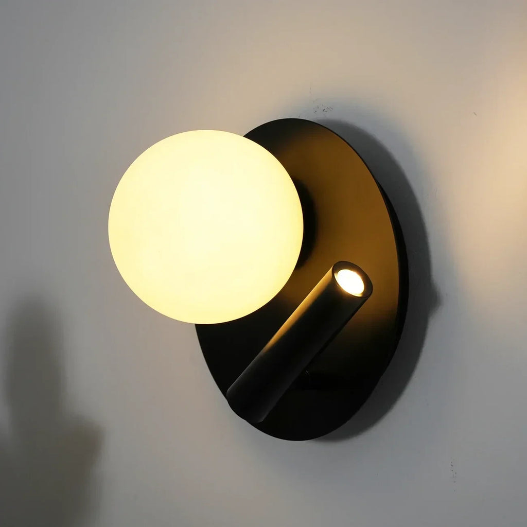 Illuminated Modern Black Disc Base Wall Sconce Side View Studio Shot