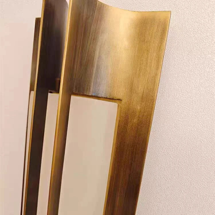 Close Up View of Winged Metal Backplate and Gold Trim Details