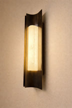 Illuminated Modern Dark Winged Base Wall Sconce Side View Studio Shot