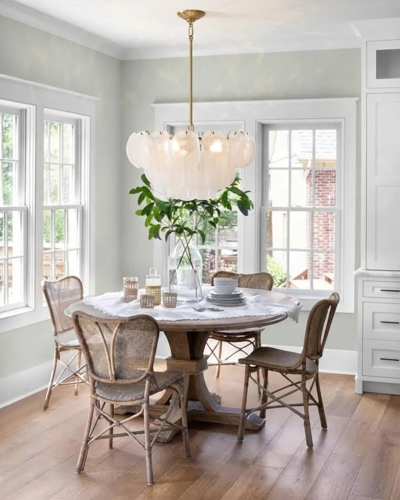 Modern White Disc Chandelier Over Round Dining Table