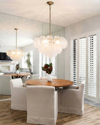 Modern White Disc Chandelier in Open Plan Dining Area