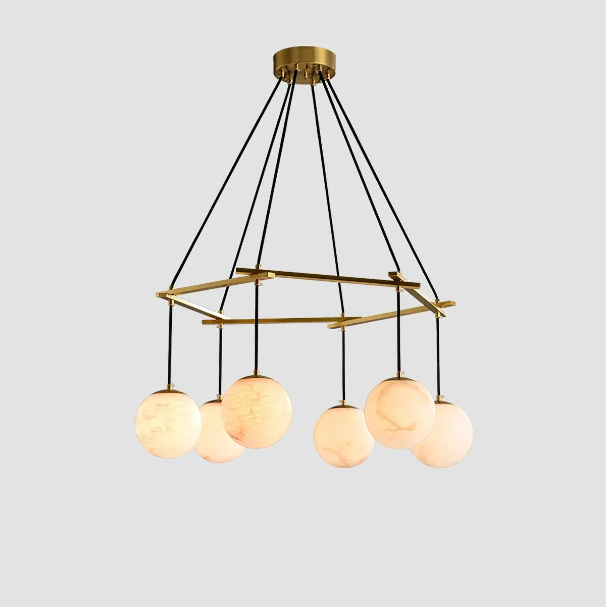 Illuminated Modern Brass Ring and Multi-Sphere Alabaster Chandelier Studio Shot on White Background