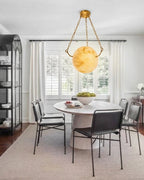 Modern Alabaster Sphere Pendant Light in Minimalist Dining Area