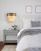 Modern Pierced Metal Band Wall Sconce in Minimalist Bedroom Interior   
