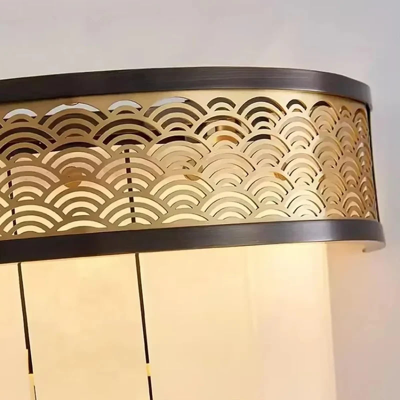 Close Up View of Pierced Metal Band Pattern and Tiered Alabaster Shades Details   