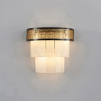 Illuminated Modern Tiered Alabaster and Pierced Metal Band Wall Sconce Studio Shot on White Background   