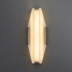 Illuminated Modern Alabaster Wall Sconce Studio Shot on Grey Background   