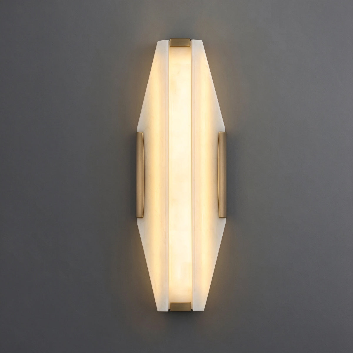 Illuminated Modern Alabaster Wall Sconce Studio Shot on Grey Background   