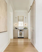 Modern Brass Pendant Rod Wall Sconce in Sophisticated Hallway Corridor