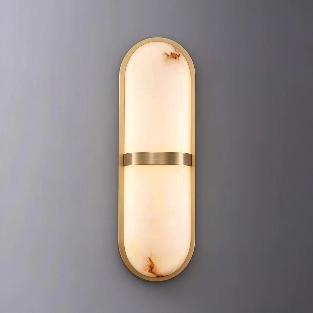 Illuminated Modern Alabaster Wall Sconce Studio Shot on Grey Background