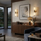 Modern Brass and Alabaster Wall Sconce Over Artwork in Living Space