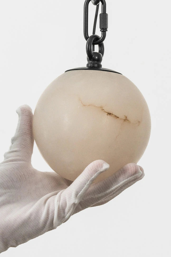 Close Up Hand View of Textured Alabaster Globe Light Shade
