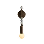 Modern Beaded Marble and Metal Rod Wall Sconce with Spherical Glass Bulb and Warm Light on Pure White Background   