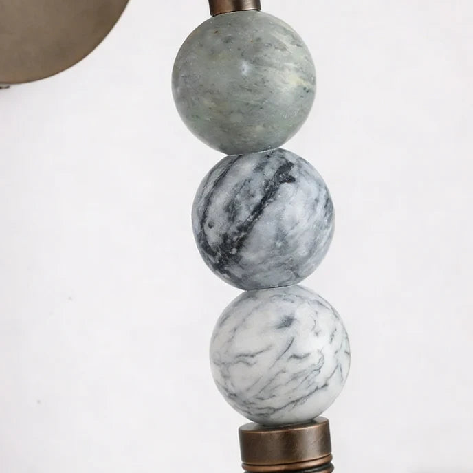 Close Up View of Stacked Beaded Marble Spheres and Natural Vein Texture Details   