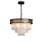 Modern Tiered Alabaster and Pierced Metal Band Chandelier with Warm Light on Pure White Background   