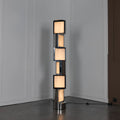 Illuminated Modern Alabaster Square Block Floor Lamp Studio Shot on Dark Background   